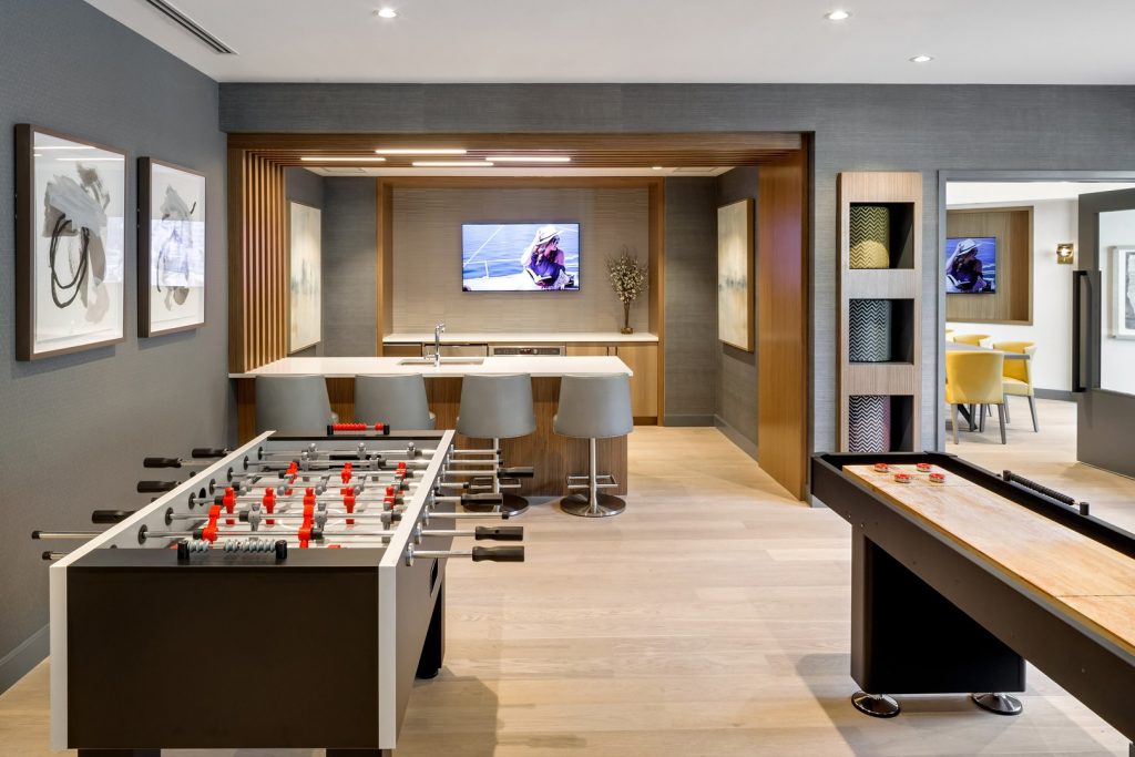 Shuffleboard and foosball area.
